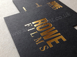 Matt black business cards printed with a metallic gold foil.