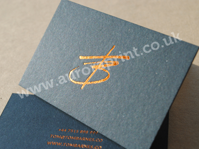 Graphite grey cairn 1000 micron business cards, foil printed with a bright metallic copper foil.