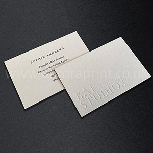 Debossed logo on these 540gsm business cards with black foil print.