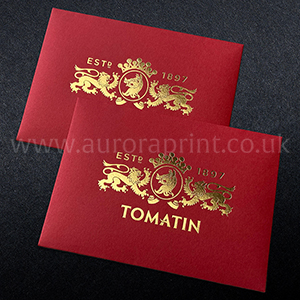 Metallic bright gold foil on C6 vermillion red envelopes.