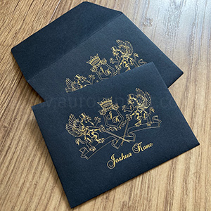 Black C6 peel and seal envelopes with gold foiled crest design.