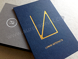 Duplexed imperial blue and smoke grey card, with metallic gold logo and white foiled contact details.