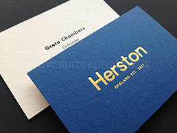 Cobalt blue and mist coloured duplexed card, with gold foiled logo and black text.