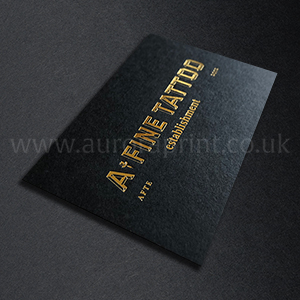 Matt black business cards with metallic gold foil print.