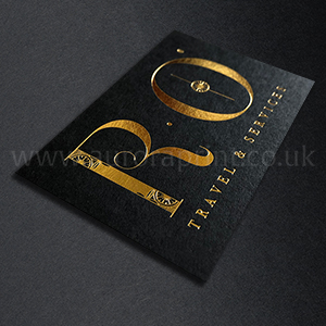 Bright metallic gold foil printed on a black business card